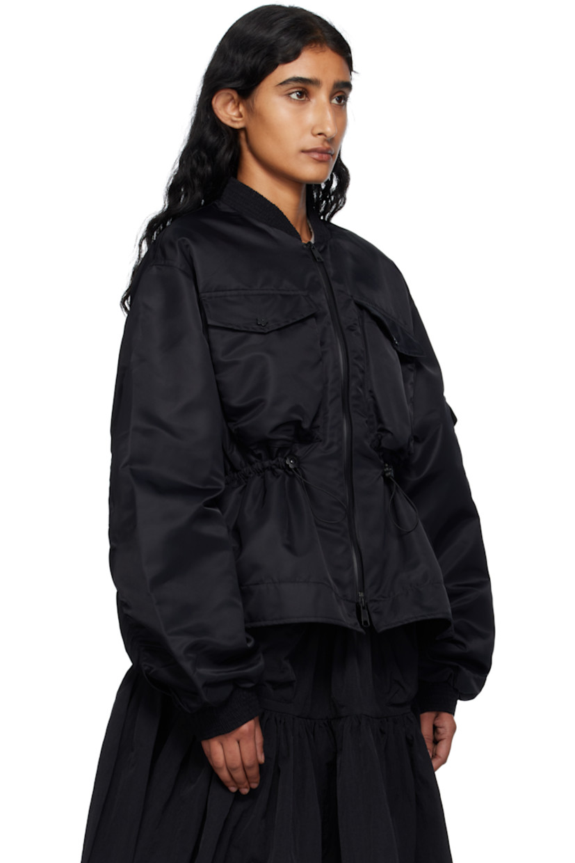 Insulated nylon taffeta bomber jacket.

· Shirring at stand collar and cuffs
· Two-way zip closure
· Flap pockets at front and sleeve
· Bungee-style drawstring at waist
· Flared hem
· Dropped shoulders
· Full satin lining

Supplier color: Black