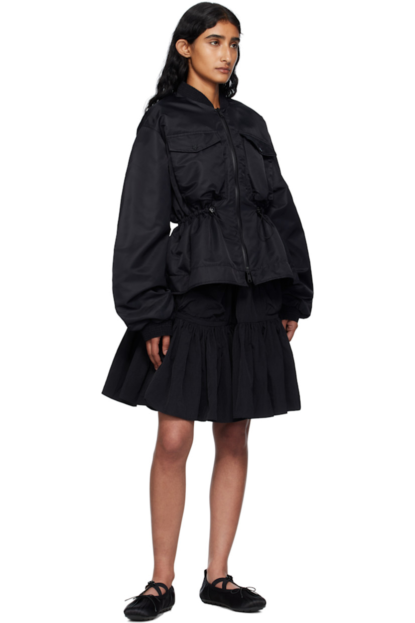 Insulated nylon taffeta bomber jacket.

· Shirring at stand collar and cuffs
· Two-way zip closure
· Flap pockets at front and sleeve
· Bungee-style drawstring at waist
· Flared hem
· Dropped shoulders
· Full satin lining

Supplier color: Black