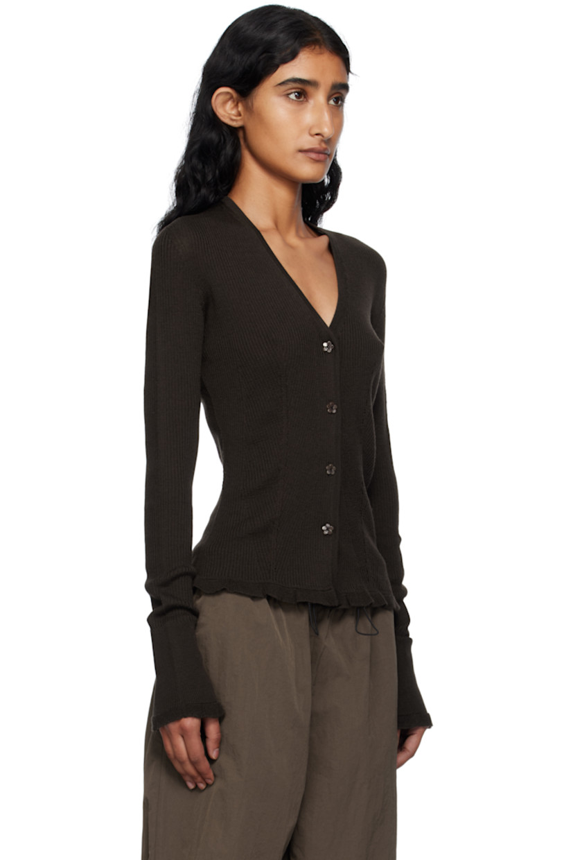 Rib-knit merino wool cardigan.

· Y-neck
· Button closure
· Ruffled trim at hem and cuffs

Supplier color: Brown