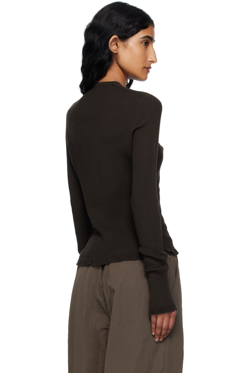 Rib-knit merino wool cardigan.

· Y-neck
· Button closure
· Ruffled trim at hem and cuffs

Supplier color: Brown