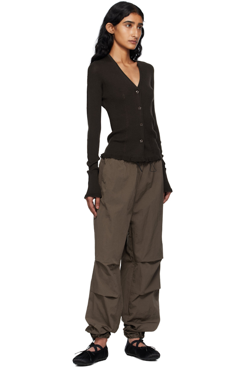 Rib-knit merino wool cardigan.

· Y-neck
· Button closure
· Ruffled trim at hem and cuffs

Supplier color: Brown