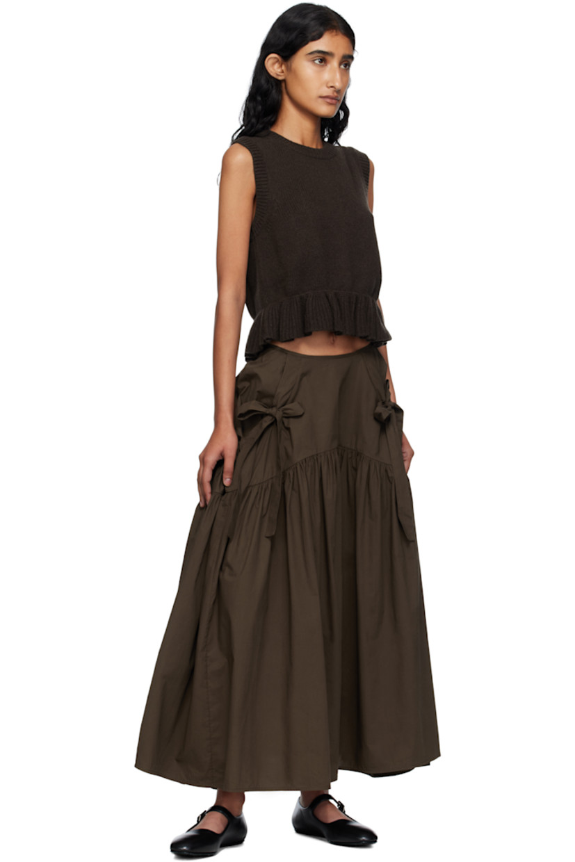 Knit recycled cashmere-blend vest.

· Rib-knit crewneck, hem, and armscyes
· Ruffled peplum hem
· Button closure at back

Supplier color: Brown