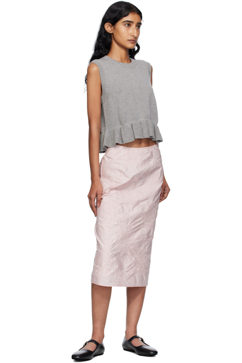 Knit recycled cashmere-blend vest.

· Rib-knit crewneck, hem, and armscyes
· Ruffled peplum hem
· Button closure at back

Supplier color: Grey
