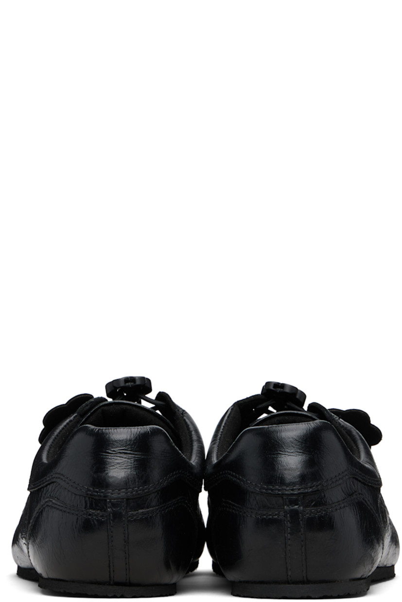 Low-top crinkled polished leather sneakers. 

· Certified Positive Luxury Butterfly Mark
· Lace-up closure with floral cord-lock hardware
· Beads and graphic appliqués at vamp
· Padded collar 
· Goatskin lining 
· Treaded crêpe rubber sole

Supplier color: Black