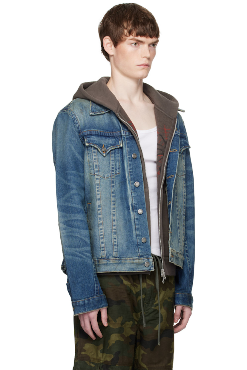 Stretch denim jacket.

· Fading, smudging, and subtle distressing throughout
· Spread collar
· Button closure
· Flap pockets at chest
· Welt pockets at waist
· Whiskering at sleeves
· Adjustable button tabs at back hem
· Logo-engraved antiqued silver-tone hardware
· Contrast stitching in tan

Supplier color: Badlands wash