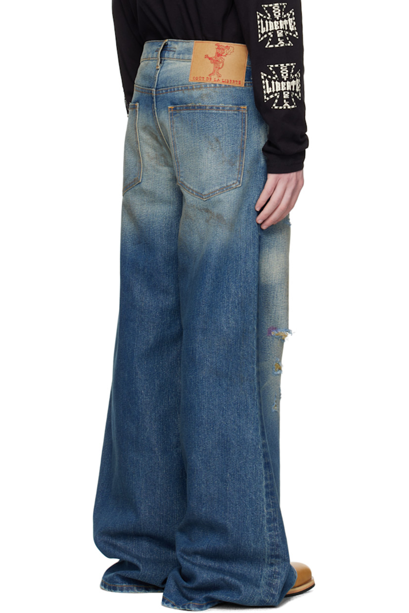 Non-stretch denim jeans. Fading, whiskering, distressing, and metallic threads throughout.

· Wide-leg
· Belt loops
· Five-pocket styling
· Button fly
· Embroidered logo patch at back waistband
· Logo-engraved antiqued silver-tone hardware
· Contrast stitching in tan

Supplier color: Cassidy
