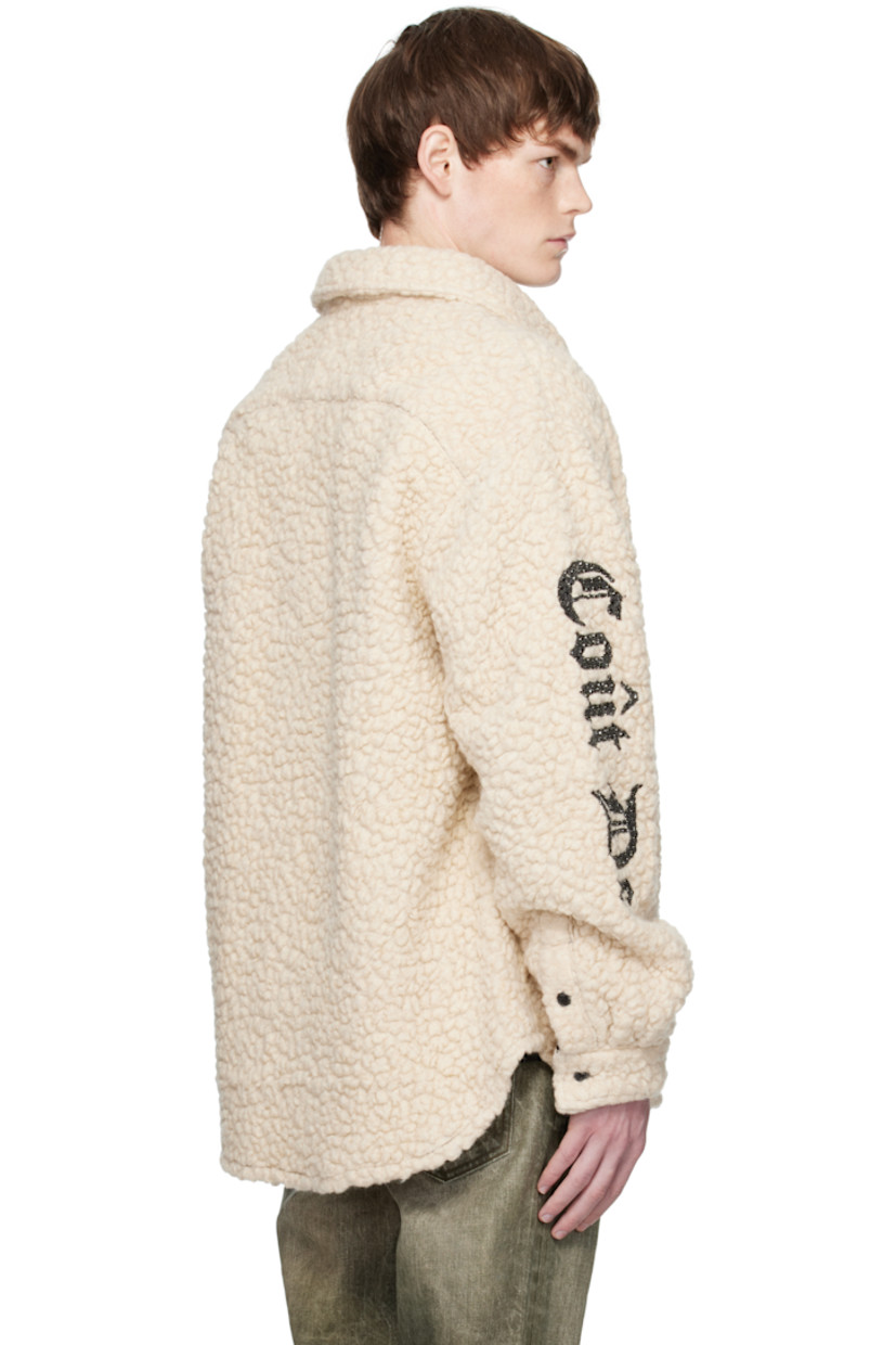 Virgin wool-blend fleece overshirt.

· Spread collar
· Button closure
· Patch pocket at chest
· Shirttail hem
· Dropped shoulders
· Mismatched logo with crystal-cut accents at sleeves
· Buttoned barrel cuffs

Supplier color: Ivory