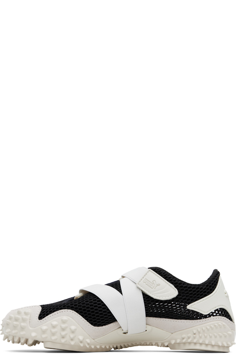 Low-top mesh sneakers in black and gray. 

· Rubberized trim throughout
· Logo patch at offset velcro strap
· Logo patch and concealed elasticized gusset at tongue
· Grained faux-leather Formstrip at outer side
· Logo embossed at heel counter
· Cushioned OrthoLite® footbed
· Faux-suede trim at welt
· Spikes at rubber midsole
· Treaded rubber sole

Supplier color: Vapor gray/Puma black