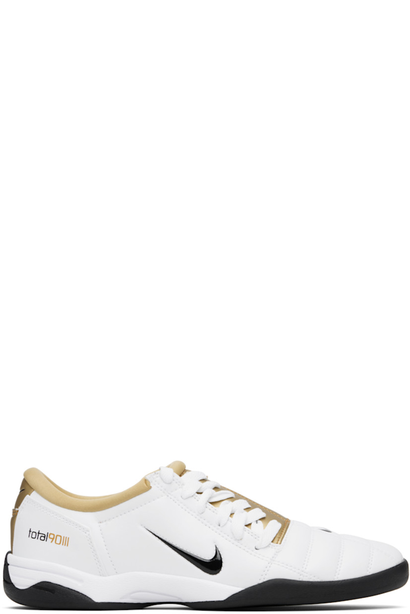Low-top quilted buffed leather sneakers.

· Swoosh embossed at vamp, sides, and heel tab
· Offset lace-up closure
· Text embossed at tongue and sides
· Jersey lining
· Treaded rubber sole

Please note that this item may be shipped only within North America.

Supplier color: White/Metallic Gold/Black