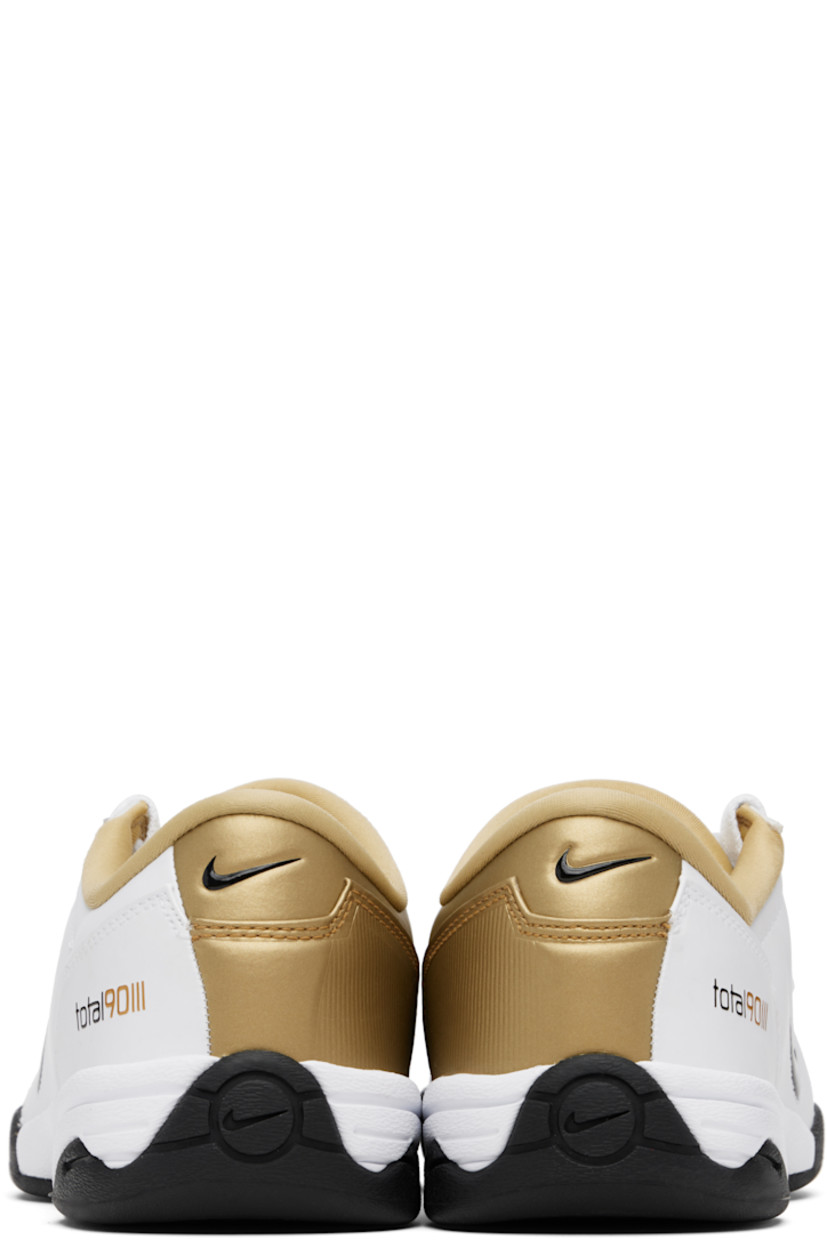 Low-top quilted buffed leather sneakers.

· Swoosh embossed at vamp, sides, and heel tab
· Offset lace-up closure
· Text embossed at tongue and sides
· Jersey lining
· Treaded rubber sole

Please note that this item may be shipped only within North America.

Supplier color: White/Metallic Gold/Black