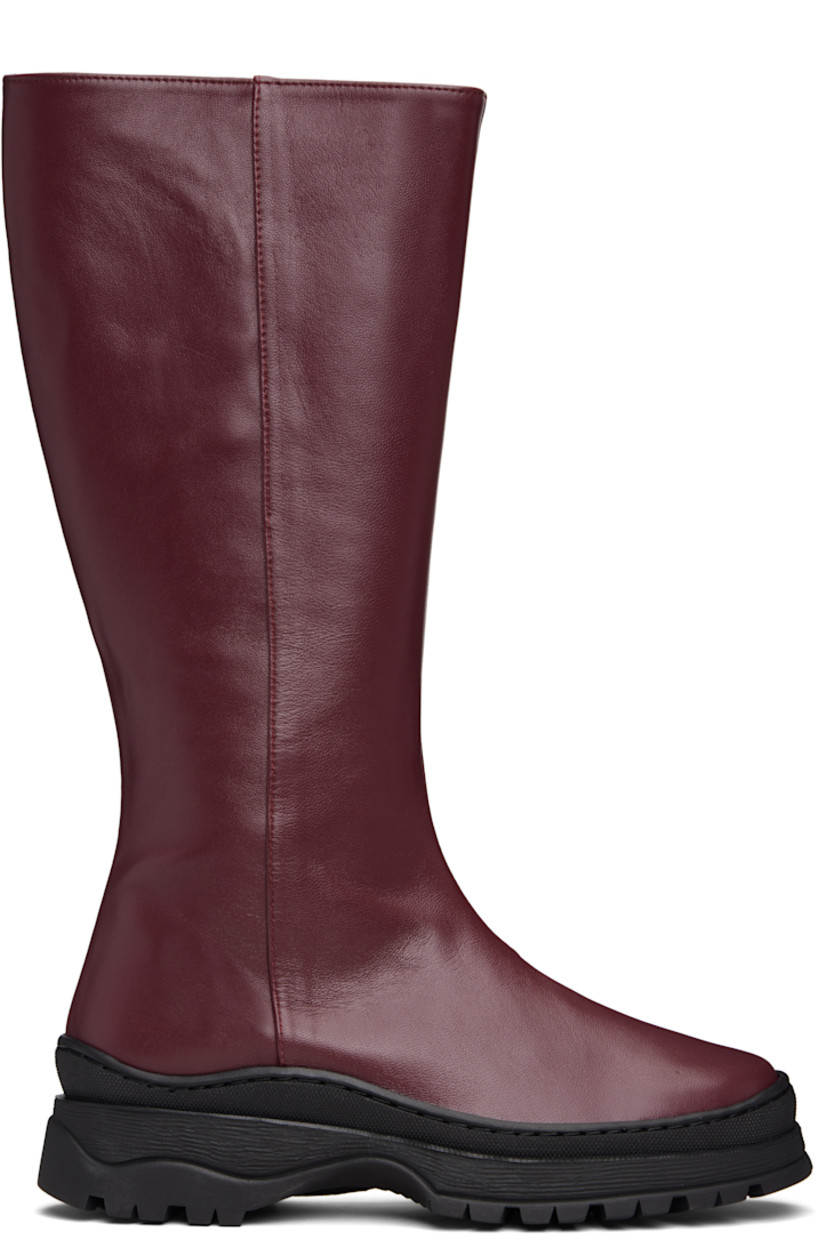 Knee-high buffed leather boots.

· Concealed elasticized gusset at collar
· Zip closure at inner side
· Buffed leather lining
· Treaded rubber sole
· Heel: H1.5"

Supplier color: Deep red