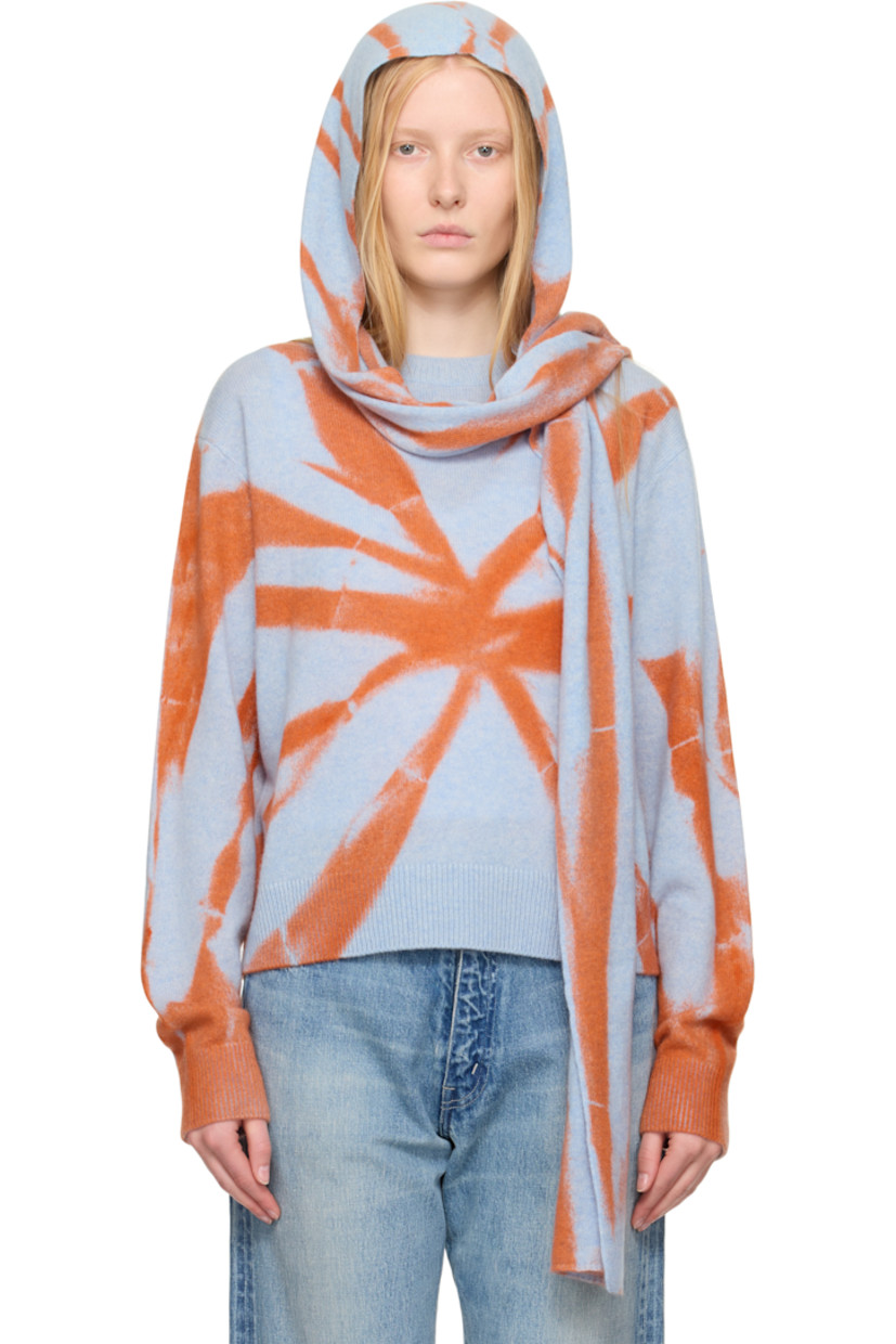 Hand-knit cashmere hood. 

· Jacquard graphic pattern throughout 
· Self-tie scarf-style straps 
· L94" x W7.5"

Supplier color: Ice/Persimmon
