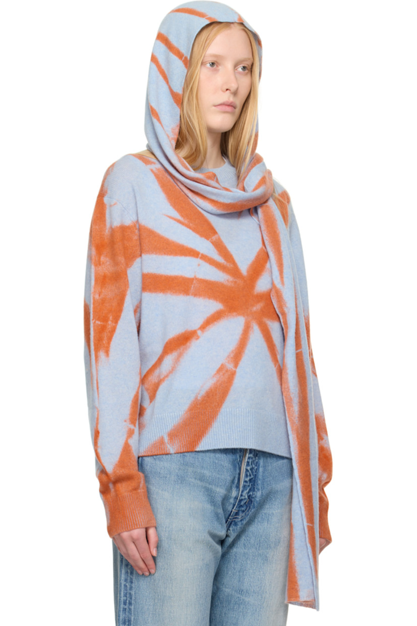 Hand-knit cashmere hood. 

· Jacquard graphic pattern throughout 
· Self-tie scarf-style straps 
· L94" x W7.5"

Supplier color: Ice/Persimmon