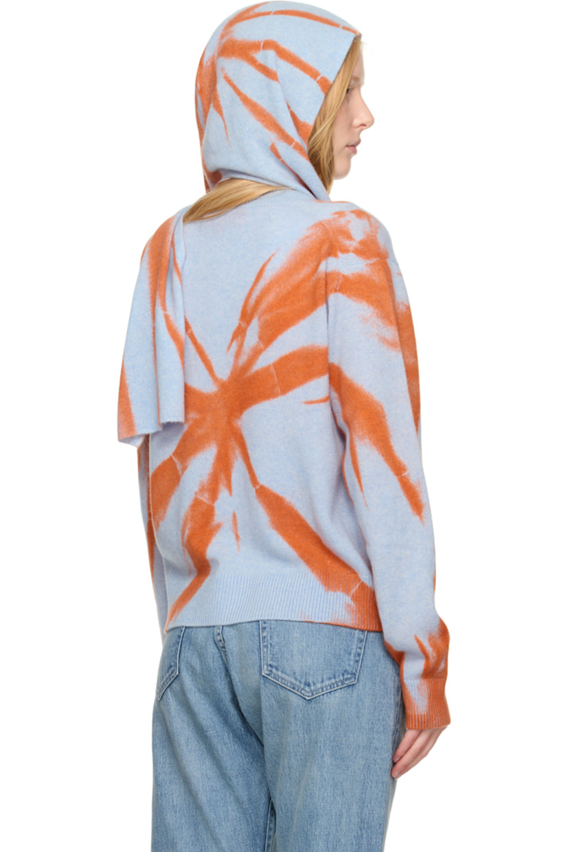 Hand-knit cashmere hood. 

· Jacquard graphic pattern throughout 
· Self-tie scarf-style straps 
· L94" x W7.5"

Supplier color: Ice/Persimmon