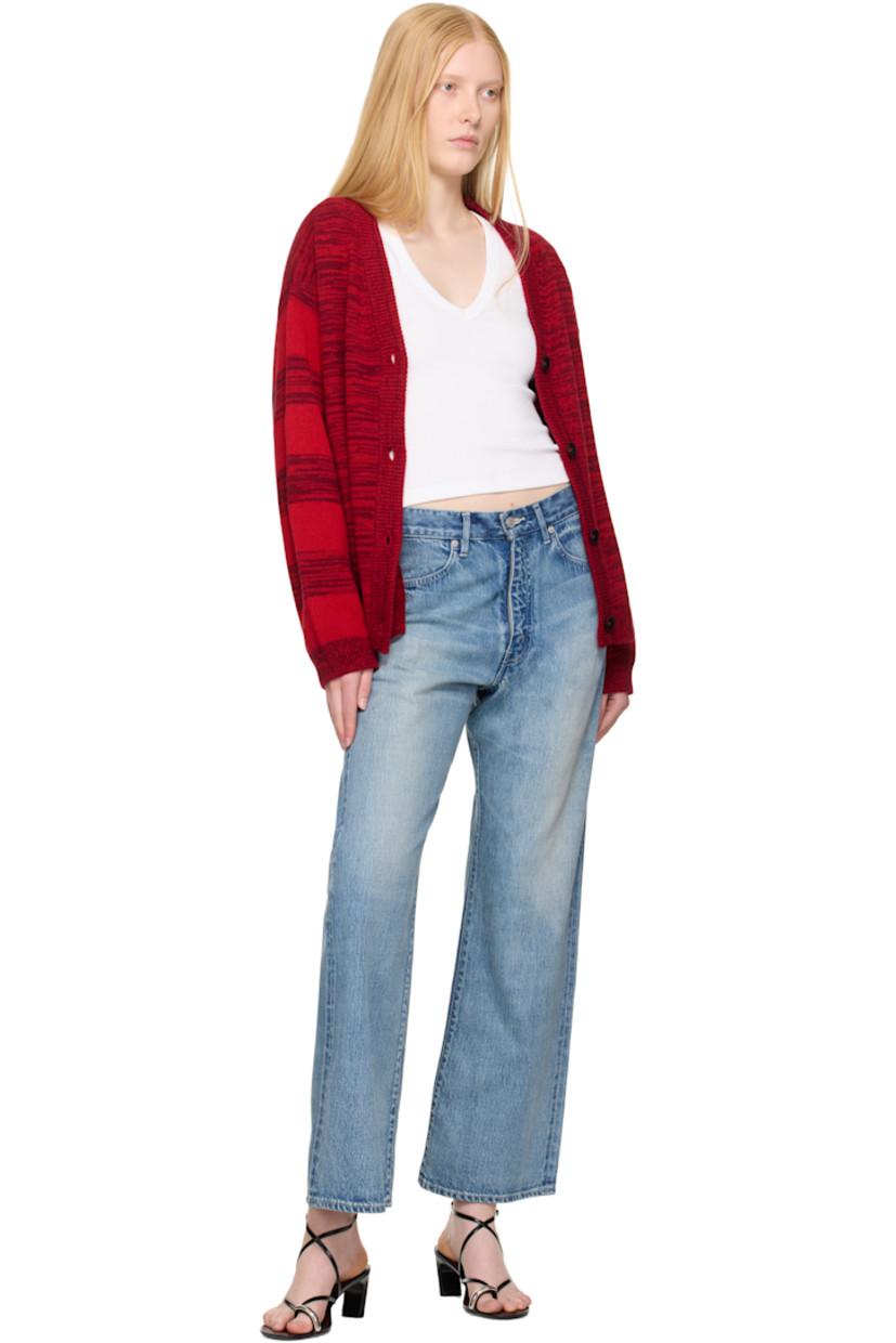 Hand-knit cashmere cardigan. Intarsia stripes and polka-dot pattern throughout. 

· Rib-knit Y-neck, hem, and cuffs
· Button closure
· Dropped shoulders
· Intarsia graphic and text at back

Supplier color: Red cedar/Bubblegum