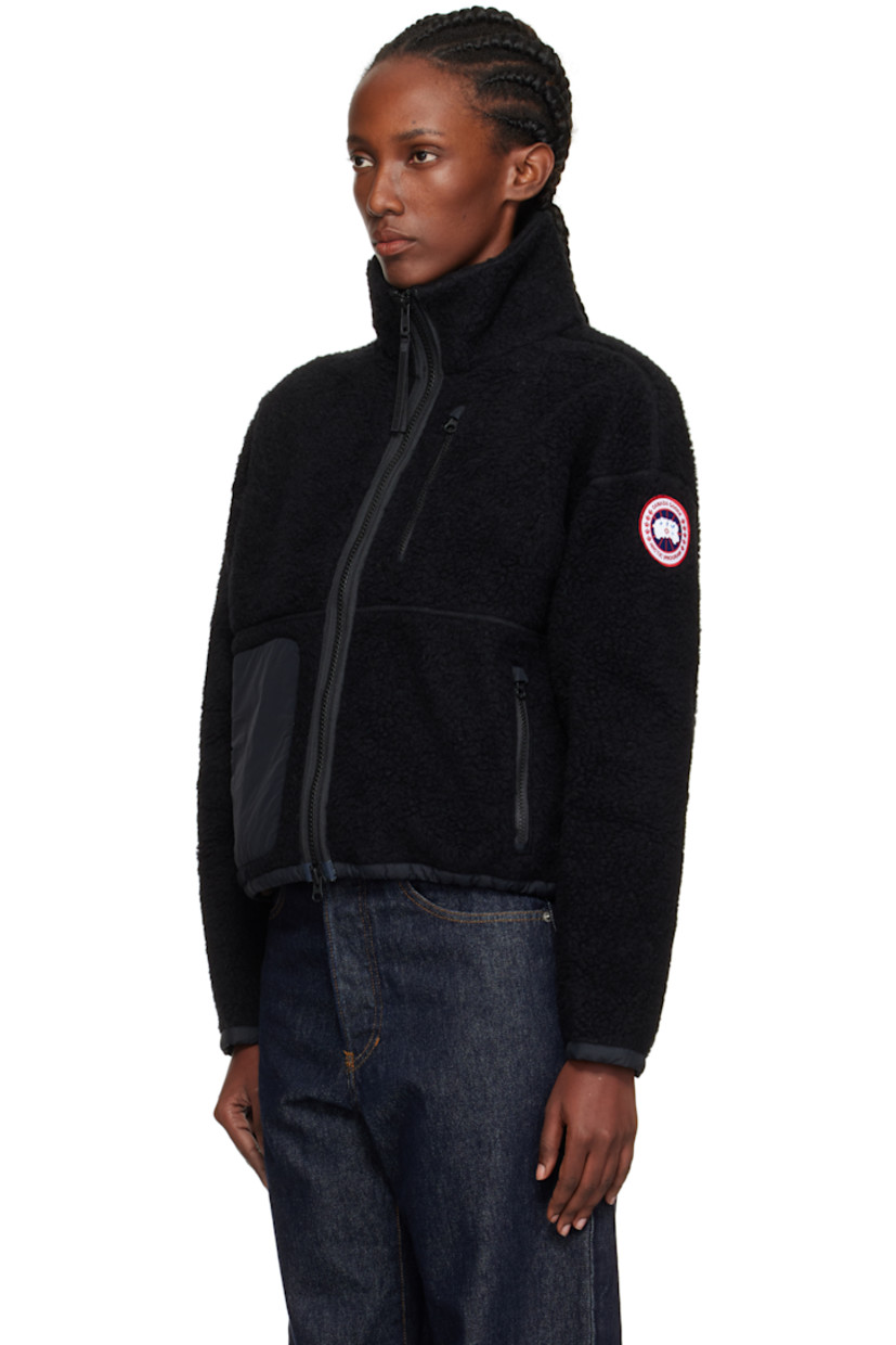 Wool-blend fleece jacket.

· Stand collar
· Two-way zip closure
· Zip pockets at front
· Taffeta trim at hem and cuffs
· Concealed bungee-style drawstring at hem
· Dropped shoulders
· Embroidered logo patch at sleeve
· Full jersey lining

Supplier color: Black