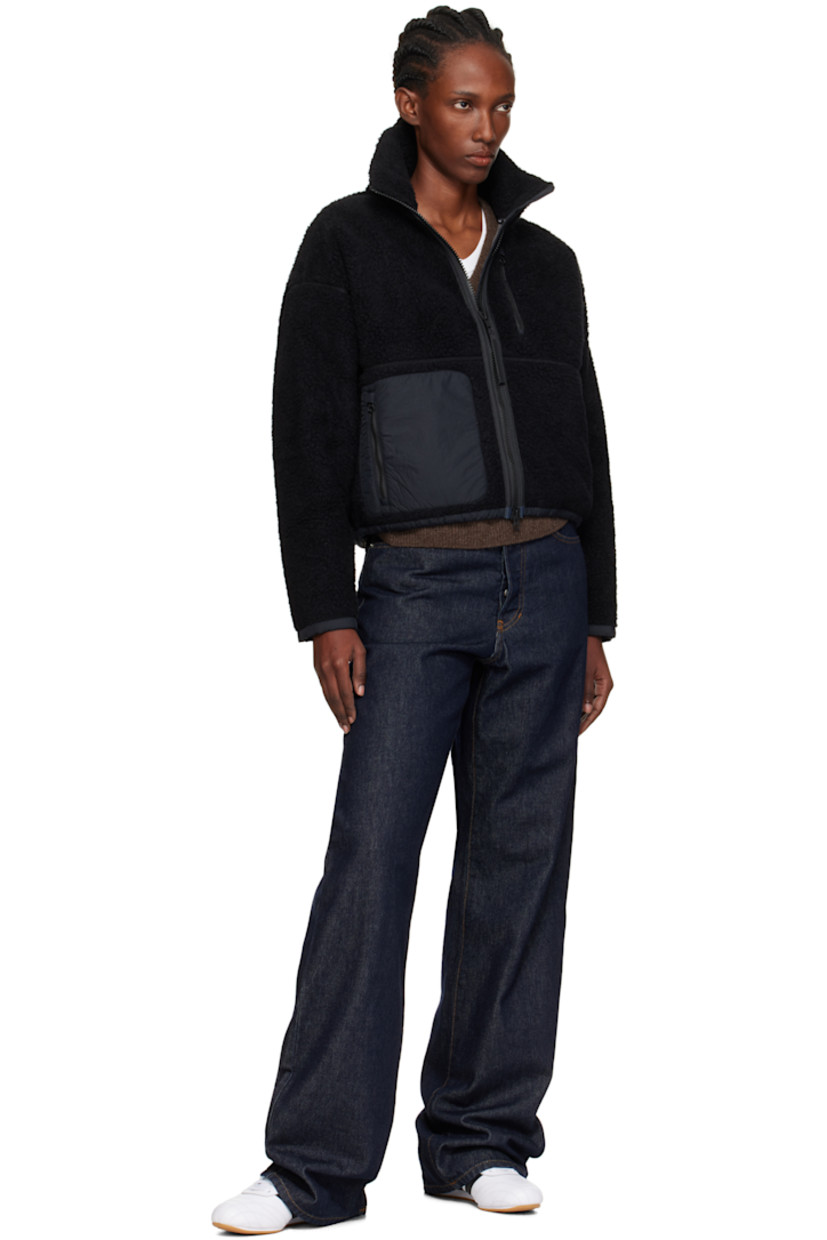 Wool-blend fleece jacket.

· Stand collar
· Two-way zip closure
· Zip pockets at front
· Taffeta trim at hem and cuffs
· Concealed bungee-style drawstring at hem
· Dropped shoulders
· Embroidered logo patch at sleeve
· Full jersey lining

Supplier color: Black