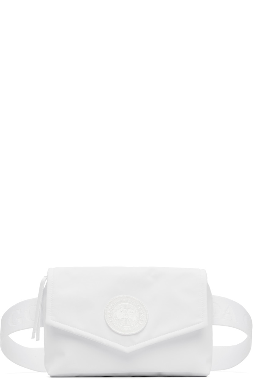 Padded Cordura® nylon taffeta belt bag in white.

· Water-repellent
· Adjustable and detachable crossbody strap
· Embroidered logo patch at face
· Press-stud flap
· Zip closure
· Patch pocket at interior
· Quilted nylon satin lining
· Logo-engraved silver-tone hardware
· H5.5" x W8" x D2"

Supplier color: White