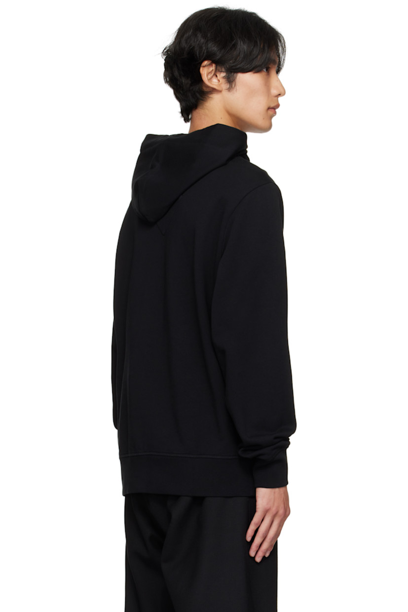 Cotton French terry hoodie.

· Drawstring at hood
· Kangaroo pocket at waist
· Rib-knit hem and cuffs
· Embroidered logo patch at sleeve

Supplier color: Black