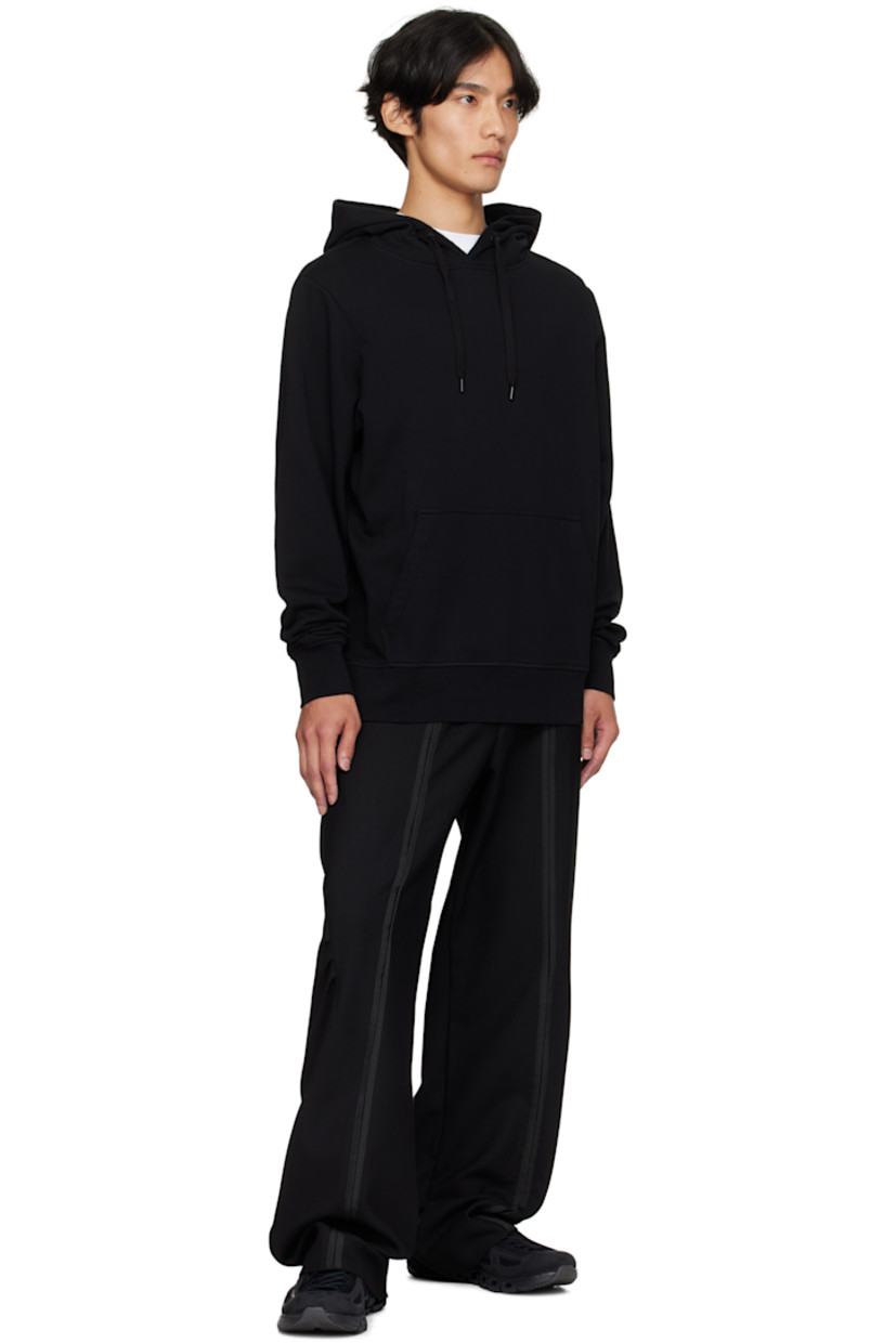 Cotton French terry hoodie.

· Drawstring at hood
· Kangaroo pocket at waist
· Rib-knit hem and cuffs
· Embroidered logo patch at sleeve

Supplier color: Black