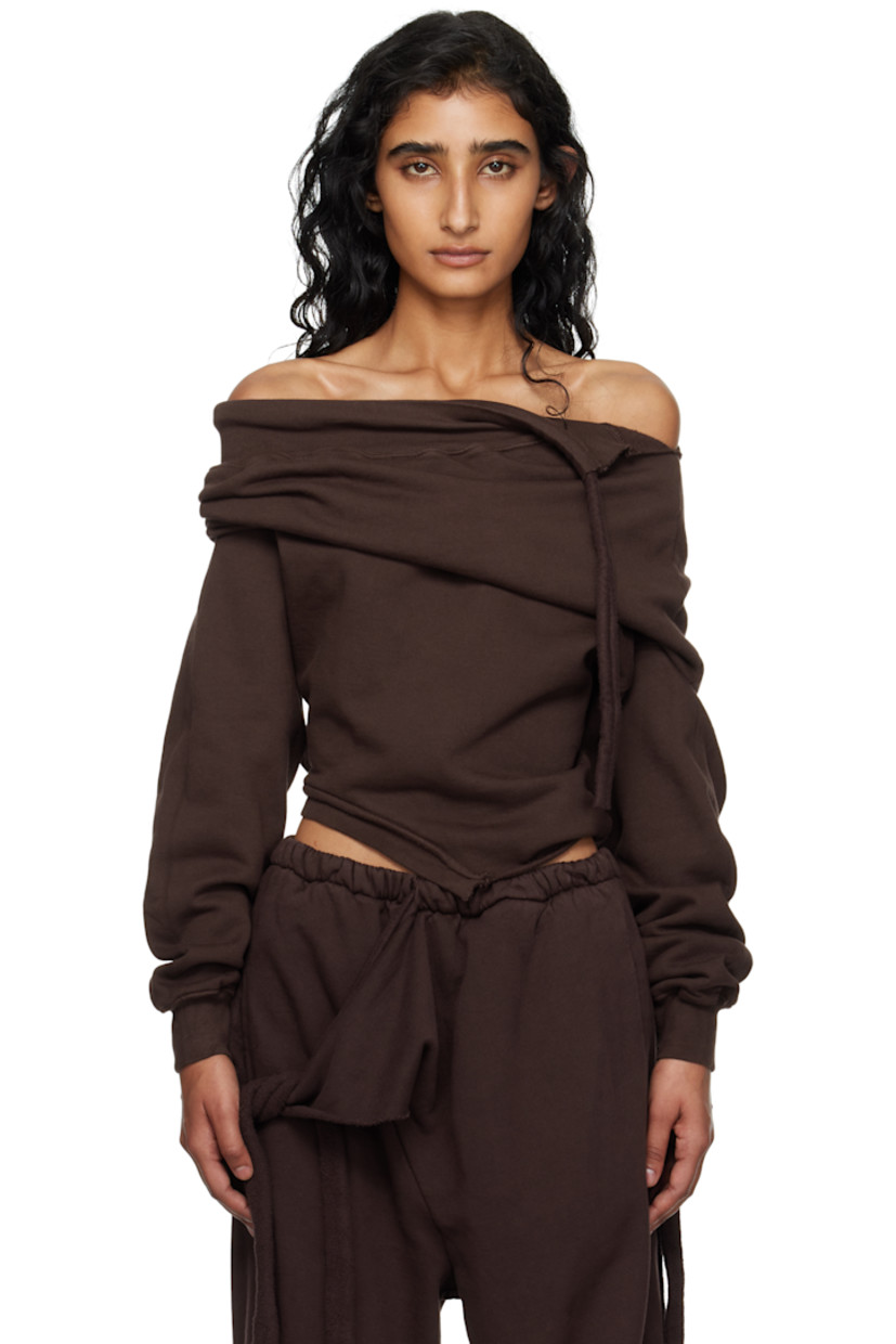 Organic cotton fleece sweater.

· Off-the-shoulder construction
· Extended trim at collar
· Raw edge at asymmetrical hem
· Rib-knit cuffs

Supplier color: Dark brown wash