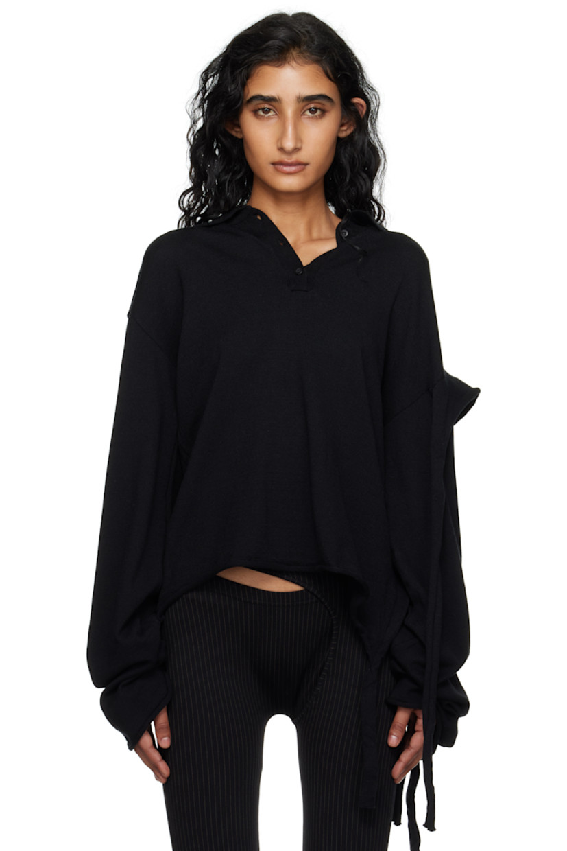 Knit viscose-blend polo.

· Logo plaque at spread collar
· Three-button placket
· Rolled edge at hem and cuffs
· Extended trim at hem and sleeve
· Dropped shoulders

Supplier color: Black