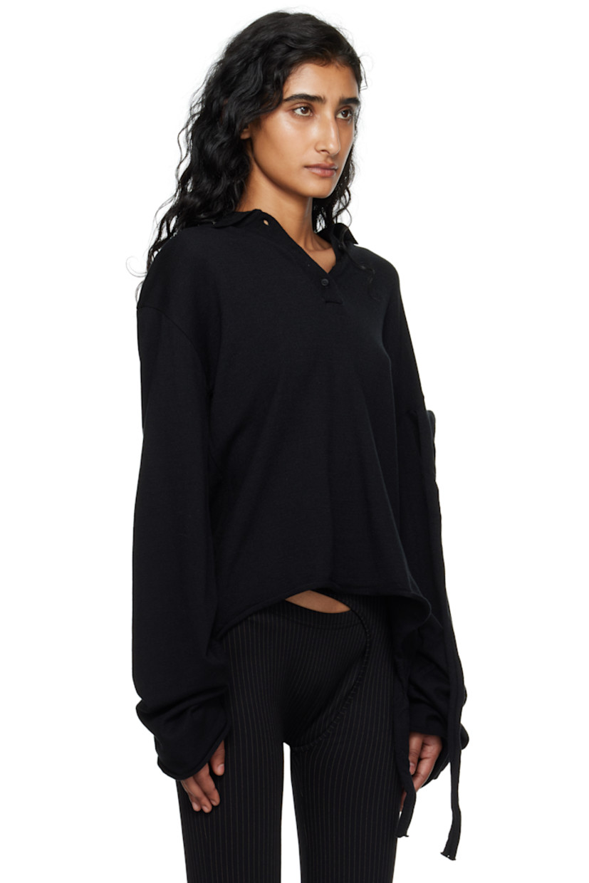 Knit viscose-blend polo.

· Logo plaque at spread collar
· Three-button placket
· Rolled edge at hem and cuffs
· Extended trim at hem and sleeve
· Dropped shoulders

Supplier color: Black