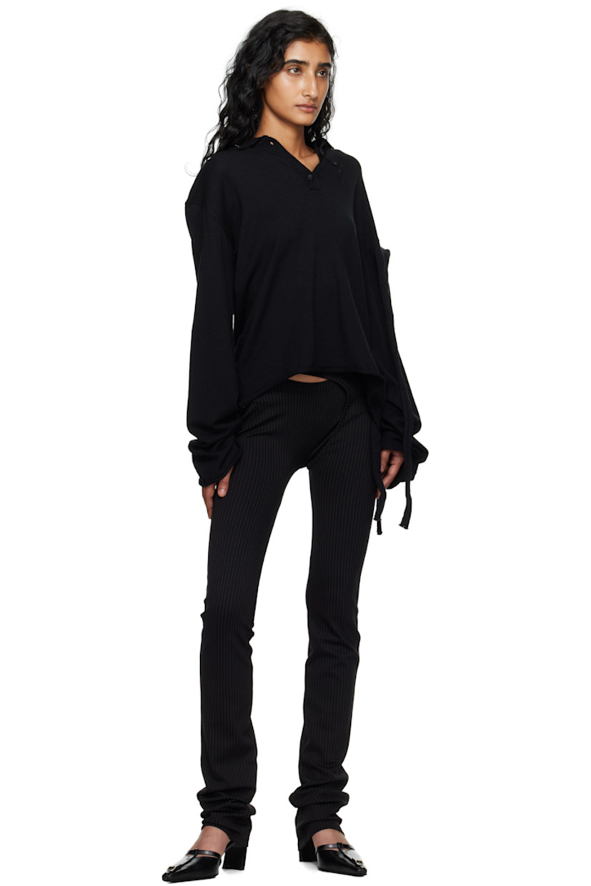 Knit viscose-blend polo.

· Logo plaque at spread collar
· Three-button placket
· Rolled edge at hem and cuffs
· Extended trim at hem and sleeve
· Dropped shoulders

Supplier color: Black