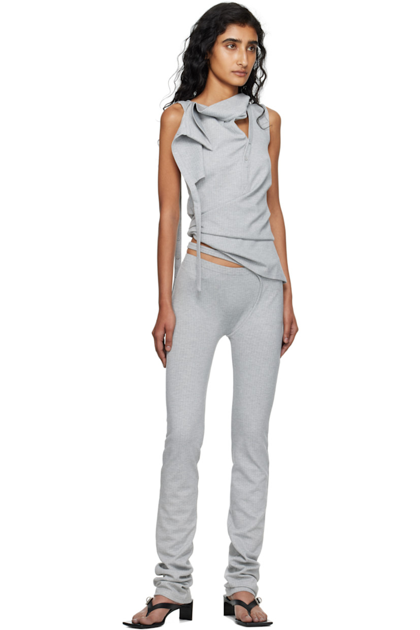 Stretch jersey top.

· Pinstripes throughout
· Asymmetrical neck
· Offset four-button placket
· Draped panel at front
· Pleats at side seams
 
Supplier color: Grey pinstripe