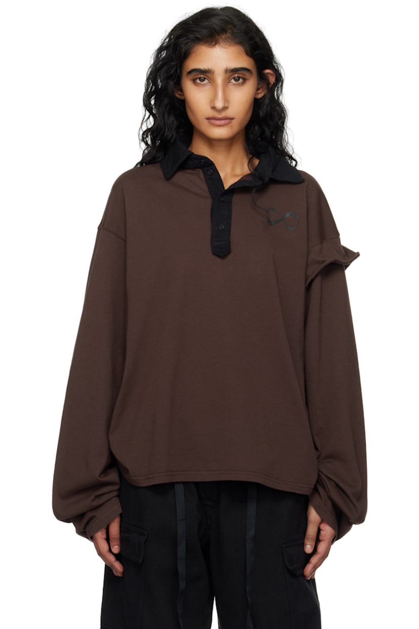 Organic cotton jersey polo.

· Spread collar
· Four-button placket
· Logo embroidered at chest
· Dropped shoulders
· Extended trim at sleeve
· Graphic printed at back

Featuring artwork from Julien Ceccaldi.

Supplier color: Dark brown wash