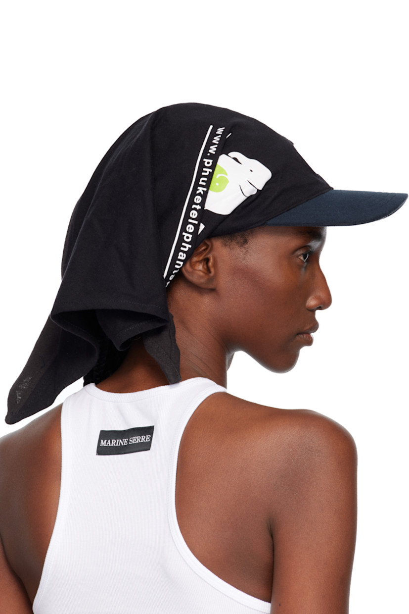 Upcycled jersey cap.

· Graphics and text printed throughout
· Bandana-style construction
· Logo embroidered at face
· Curved brim
· Cinch fastening

Each item is unique. Please note that graphics may vary.

Supplier color: Black