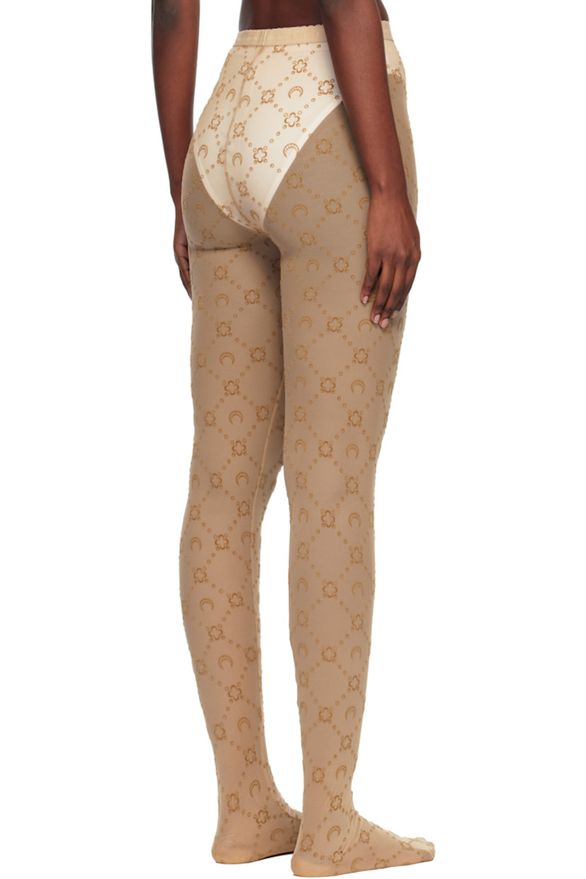 Sheer stretch recycled nylon mesh tights.

· Logo pattern flocked throughout
· High-rise
· Scalloped edge at logo-woven elasticized waistband
· Logo flag at front

Supplier color: Moonogram flock mesh camel