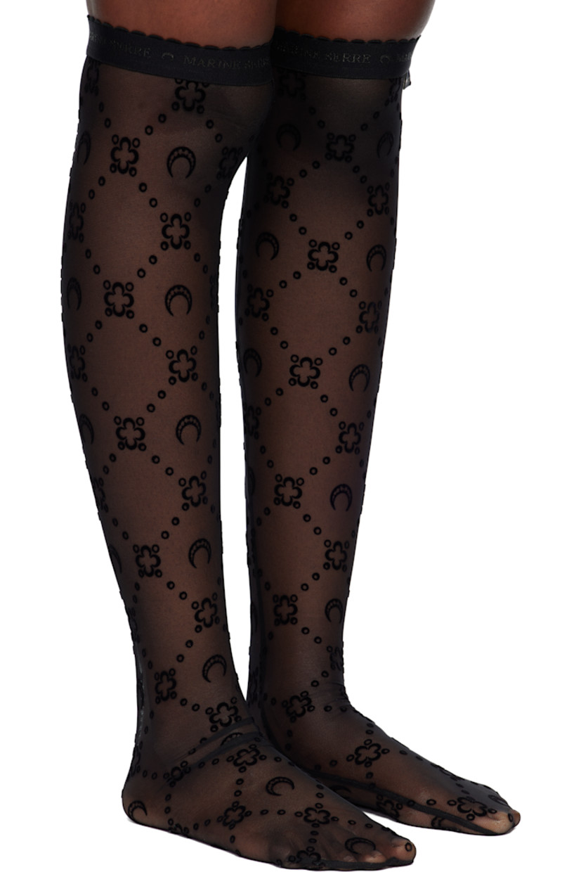 Pair of knee-high sheer stretch recycled nylon mesh socks.

· Logo pattern flocked throughout
· Scalloped edge at logo-woven elasticized cuffs
· Logo flag at cuff

Supplier color: Moonogram black