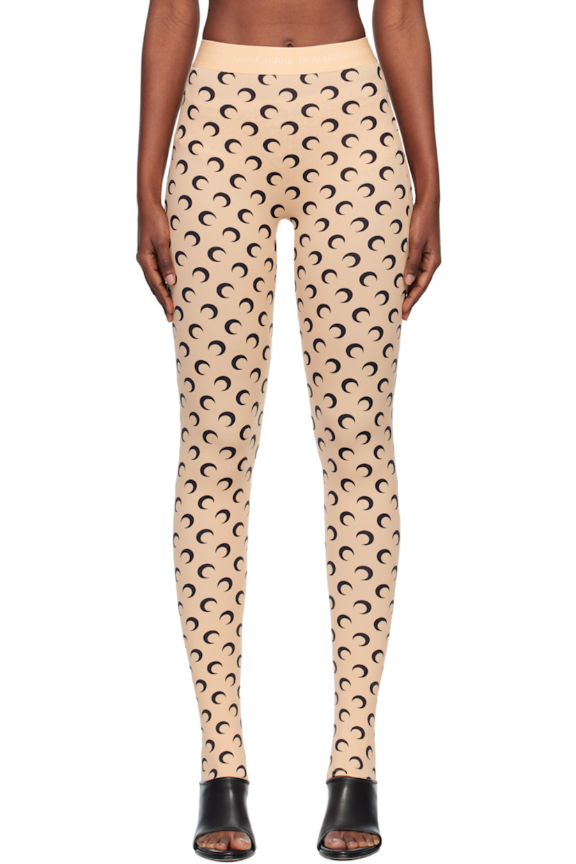 Stretch recycled nylon jersey leggings.

· Logo pattern printed throughout
· Logo-woven elasticized waistband
· Stirrup at cuffs

Supplier color: Moon black on tan
