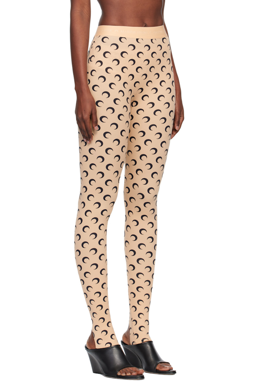 Stretch recycled nylon jersey leggings.

· Logo pattern printed throughout
· Logo-woven elasticized waistband
· Stirrup at cuffs

Supplier color: Moon black on tan