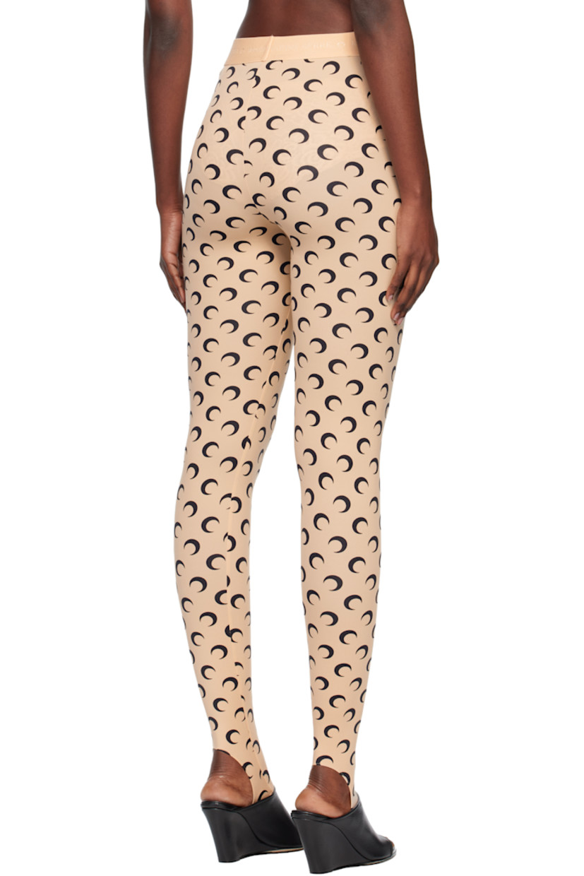 Stretch recycled nylon jersey leggings.

· Logo pattern printed throughout
· Logo-woven elasticized waistband
· Stirrup at cuffs

Supplier color: Moon black on tan