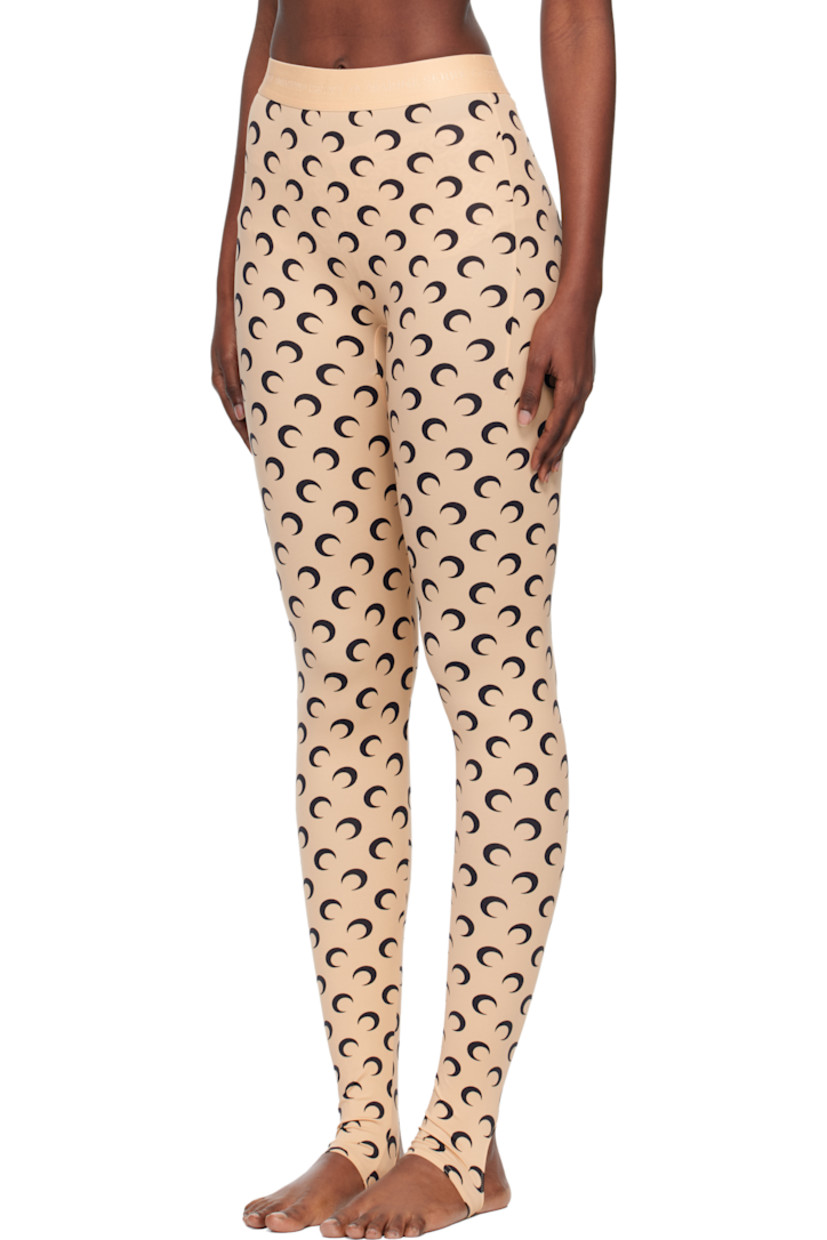 Stretch recycled nylon jersey leggings.

· Logo pattern printed throughout
· Logo-woven elasticized waistband
· Stirrup at cuffs

Supplier color: Moon black on tan
