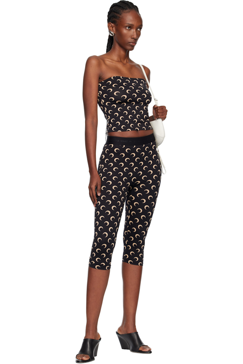 Stretch recycled nylon jersey leggings.

· Logo pattern printed throughout
· Logo-woven elasticized waistband

Supplier color: Moon tan on black