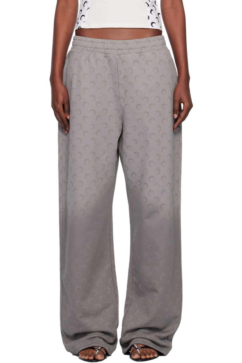 French terry sweatpants.

· Fading and printed logo pattern throughout 
· Loose-fit
· Mid-rise
· Concealed drawstring at elasticized waistband
· Two-pocket styling
· Logo flag at outseam

Supplier color: Moon faded fleece dark grey
