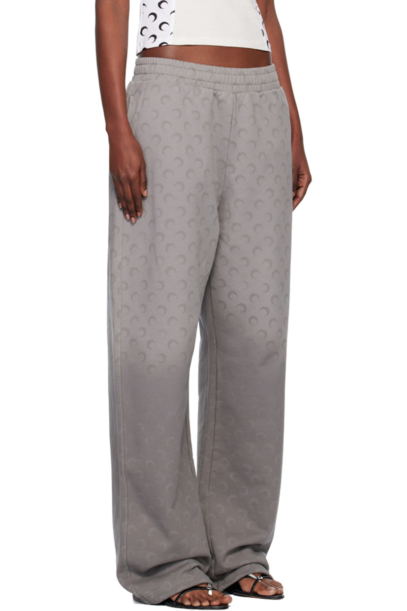 French terry sweatpants.

· Fading and printed logo pattern throughout 
· Loose-fit
· Mid-rise
· Concealed drawstring at elasticized waistband
· Two-pocket styling
· Logo flag at outseam

Supplier color: Moon faded fleece dark grey