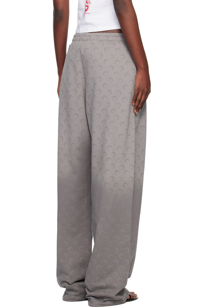 French terry sweatpants.

· Fading and printed logo pattern throughout 
· Loose-fit
· Mid-rise
· Concealed drawstring at elasticized waistband
· Two-pocket styling
· Logo flag at outseam

Supplier color: Moon faded fleece dark grey