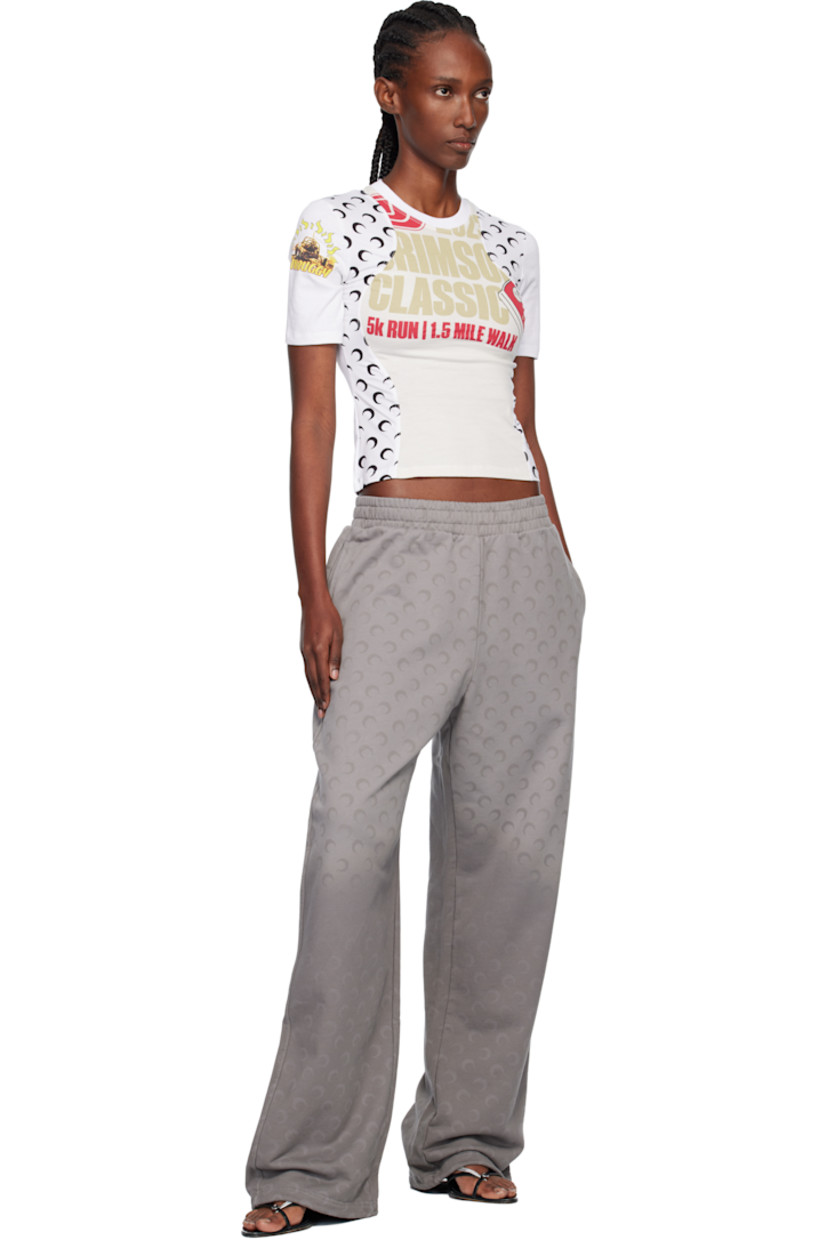 French terry sweatpants.

· Fading and printed logo pattern throughout 
· Loose-fit
· Mid-rise
· Concealed drawstring at elasticized waistband
· Two-pocket styling
· Logo flag at outseam

Supplier color: Moon faded fleece dark grey
