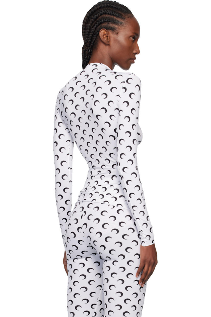 Stretch recycled nylon jersey top.

· Logo pattern printed throughout
· Mock neck
· Raw edge at hem and cuffs

Supplier color: Optical white