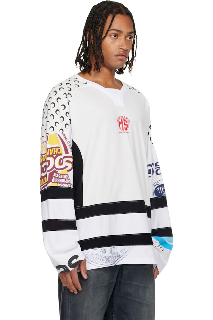 Cotton jersey T-shirt. 

· Stripes, logo pattern, and graphics throughout 
· Rib-knit V-neck
· Logo printed at chest
· Raglan sleeves
· Vented side seams 

Supplier color: White