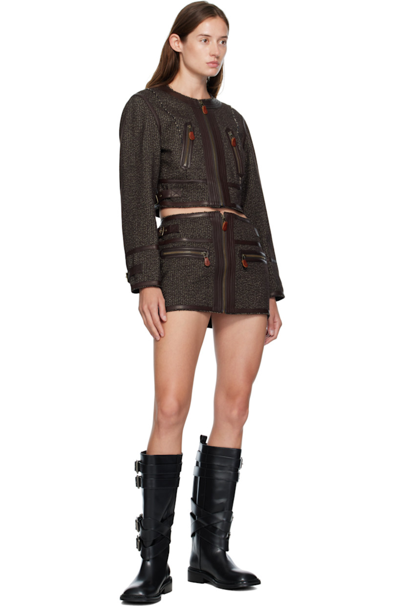 Brushed woven cotton- and wool-blend jacket.

· Buffed leather trim and raw edges throughout
· Round neck
· Zip closure
· Darts at front and back
· Zip pockets at waist
· Cropped hem
· Pin-buckle tab at side seams and cuffs
· Unlined
· Antiqued brass-tone hardware

Supplier color: Brown