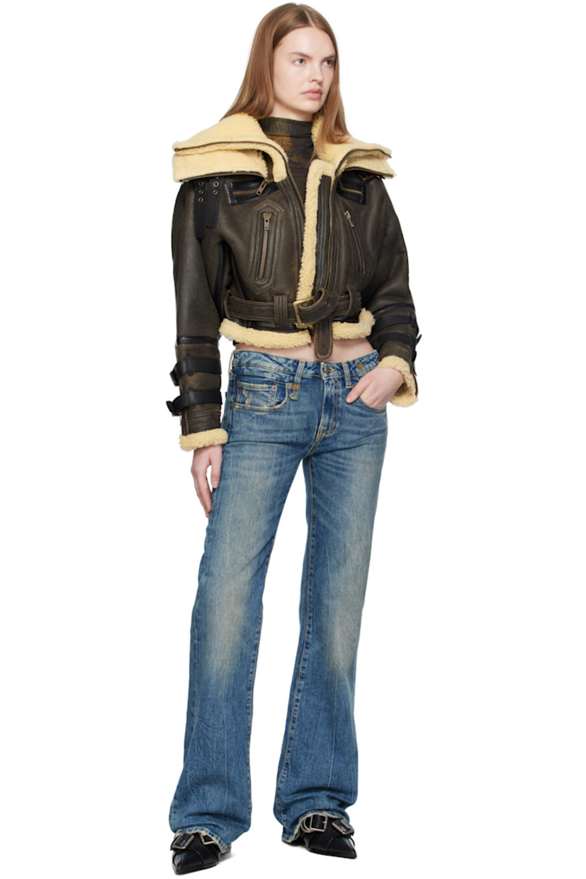 Dyed shearling jacket. 

· Layered funnel necks
· Pin-buckle straps at collar and cuffs
· Zip closure
· Zip pockets at waist
· Cropped hem
· Belt loops and detachable pin-buckle belt at hem
· Zip vent at cuffs

Supplier color: Black with cream