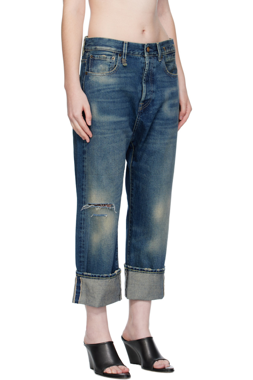 Non-stretch selvedge denim jeans.

· Fading, whiskering, and distressing throughout
· Loose-fit
· Belt loops
· Five-pocket styling
· Button fly
· Rips at knee
· Rolled cuffs
· Leather logo patch at back waistband
· Logo-engraved antiqued gold-tone hardware
· Contrast stitching in beige and tan

Supplier color: Adelaide selvedge blue