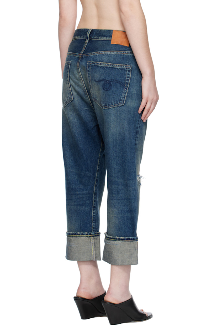 Non-stretch selvedge denim jeans.

· Fading, whiskering, and distressing throughout
· Loose-fit
· Belt loops
· Five-pocket styling
· Button fly
· Rips at knee
· Rolled cuffs
· Leather logo patch at back waistband
· Logo-engraved antiqued gold-tone hardware
· Contrast stitching in beige and tan

Supplier color: Adelaide selvedge blue