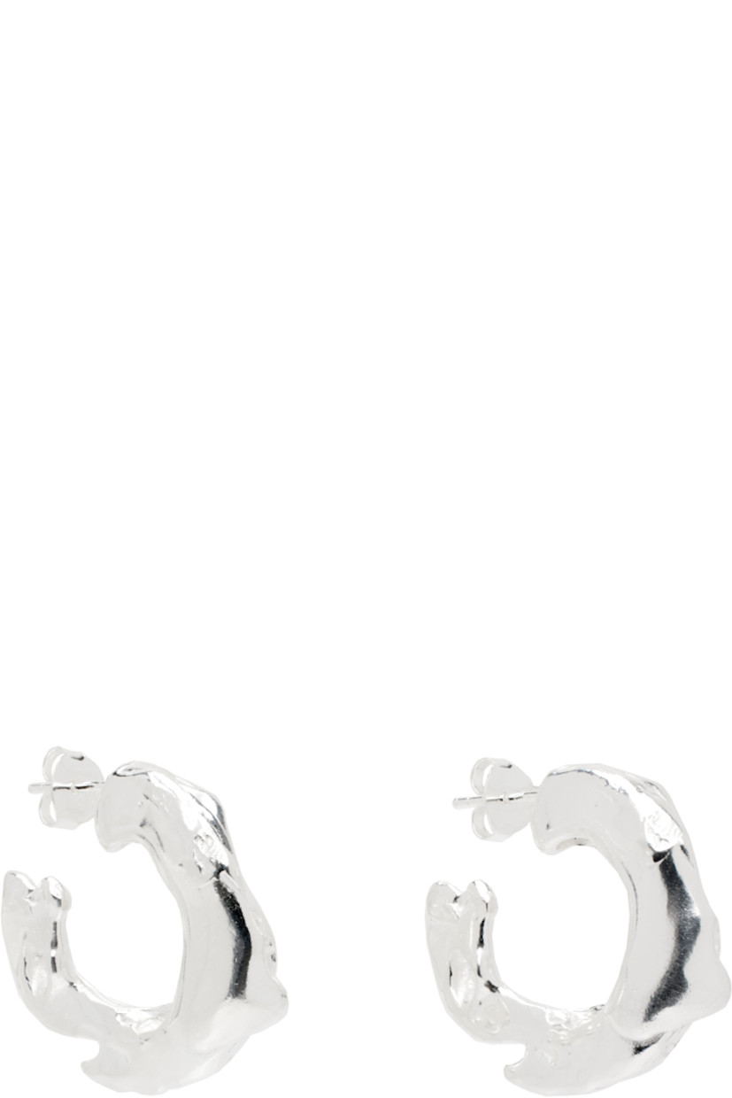 Pair of handcrafted open-hoop earrings in recycled sterling silver. 

· Textured detailing throughout
· Post-stud fastening 
· D1"

Part of the Seda collection. 

Supplier color: Silver