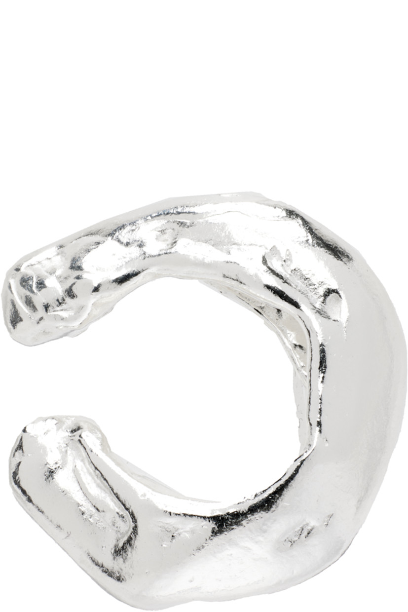 Single handcrafted ear cuff in recycled sterling silver.

· Textured detailing throughout
· D0.5"

Part of the El Fruto collection. 

Supplier color: Silver